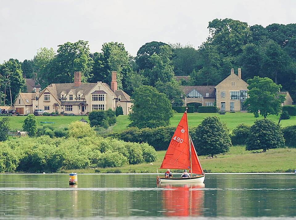 a sailing boat in front of the Normanton Hotel on Rutland Water